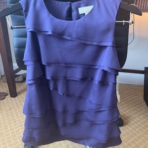 Brand new size XS Michael Kors blouse. NWT, deep purple, sleeveless.